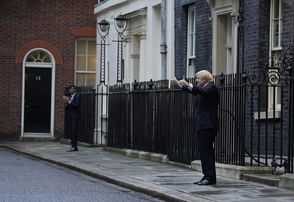 Boris Johnson and Rishi Sunak clap for the NHS