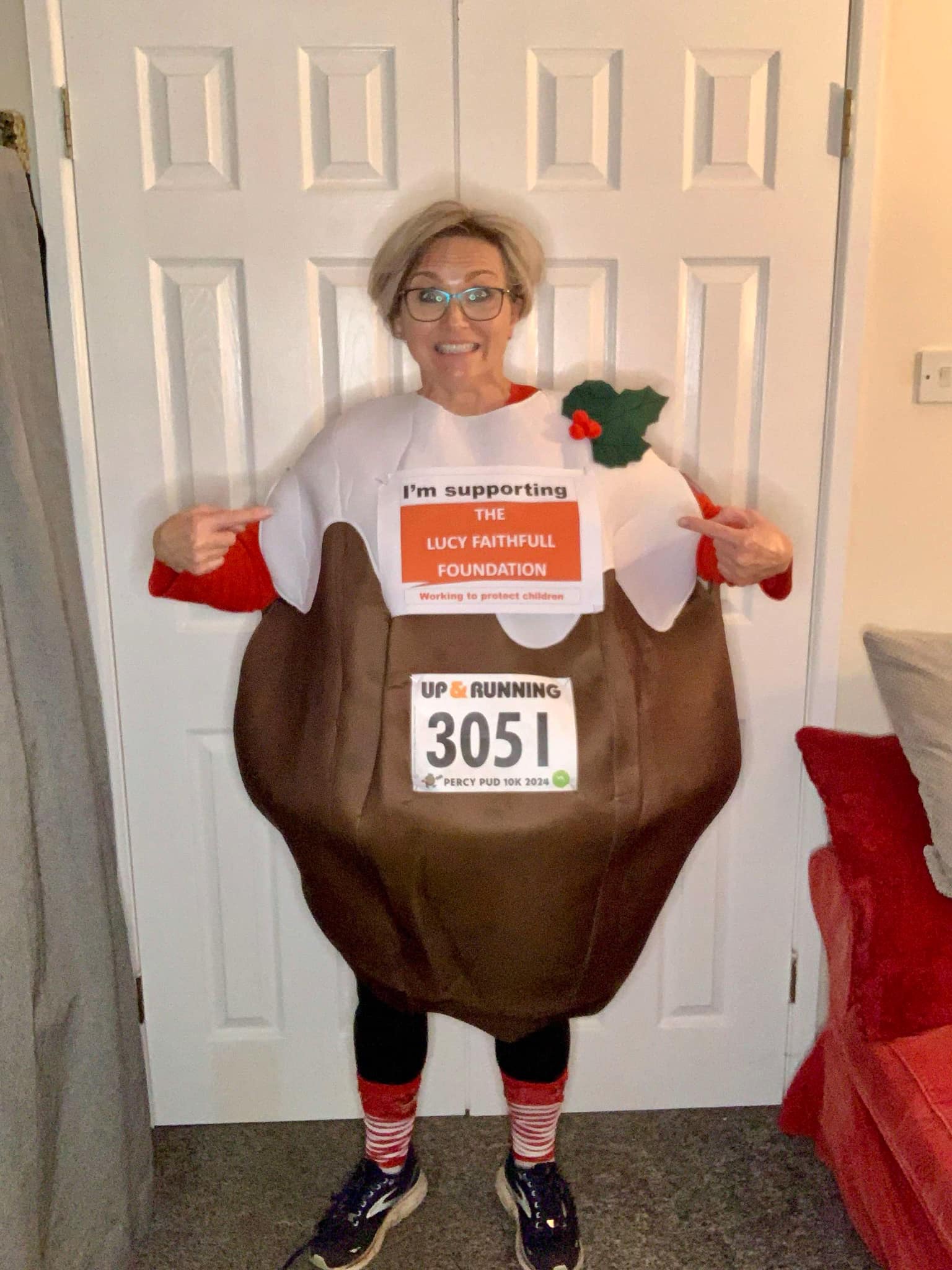 Katy Scott in a Christmas Pudding suit.