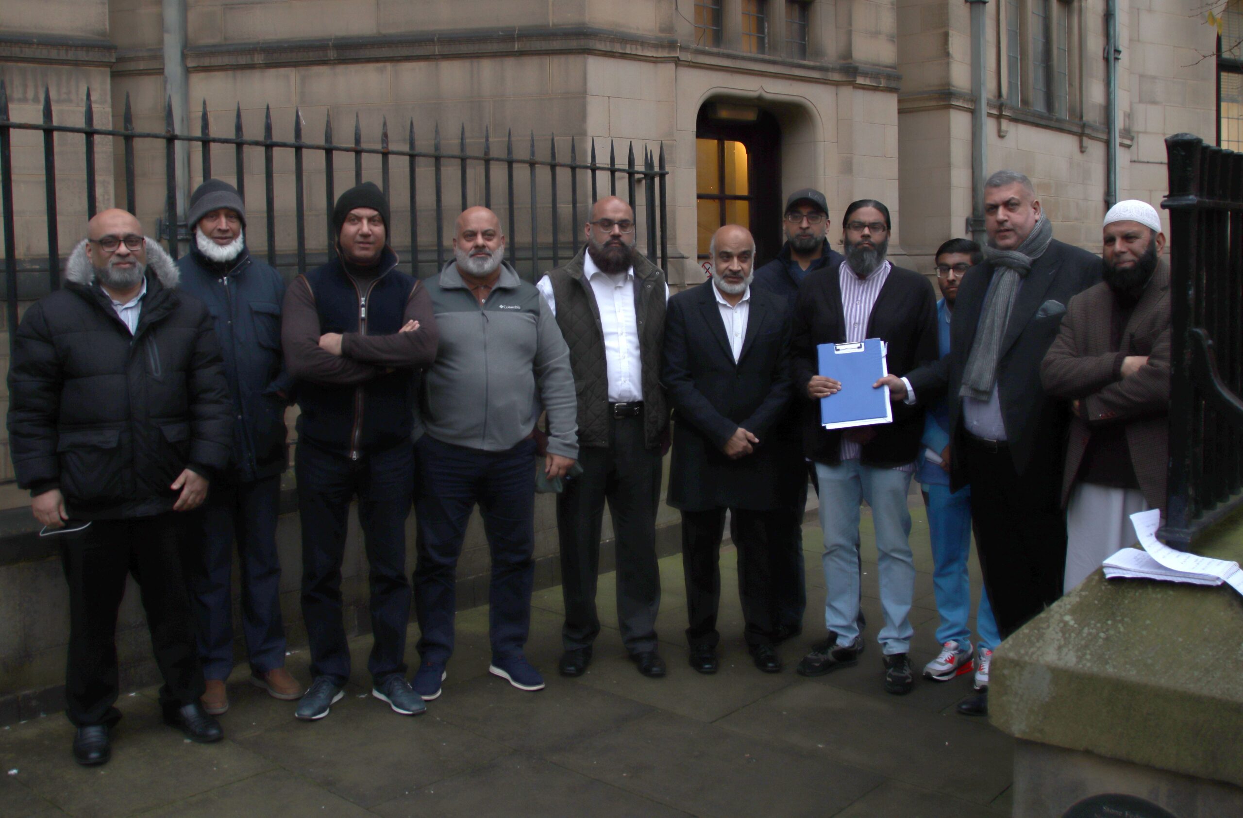 A group of campaigners for more burial spaces for the Muslim community in Sheffield pose for a photo