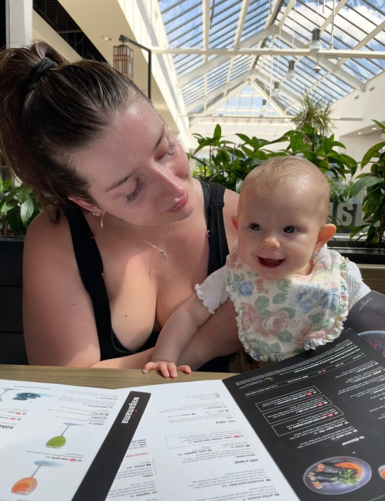 Bethany and her baby at a restaurant