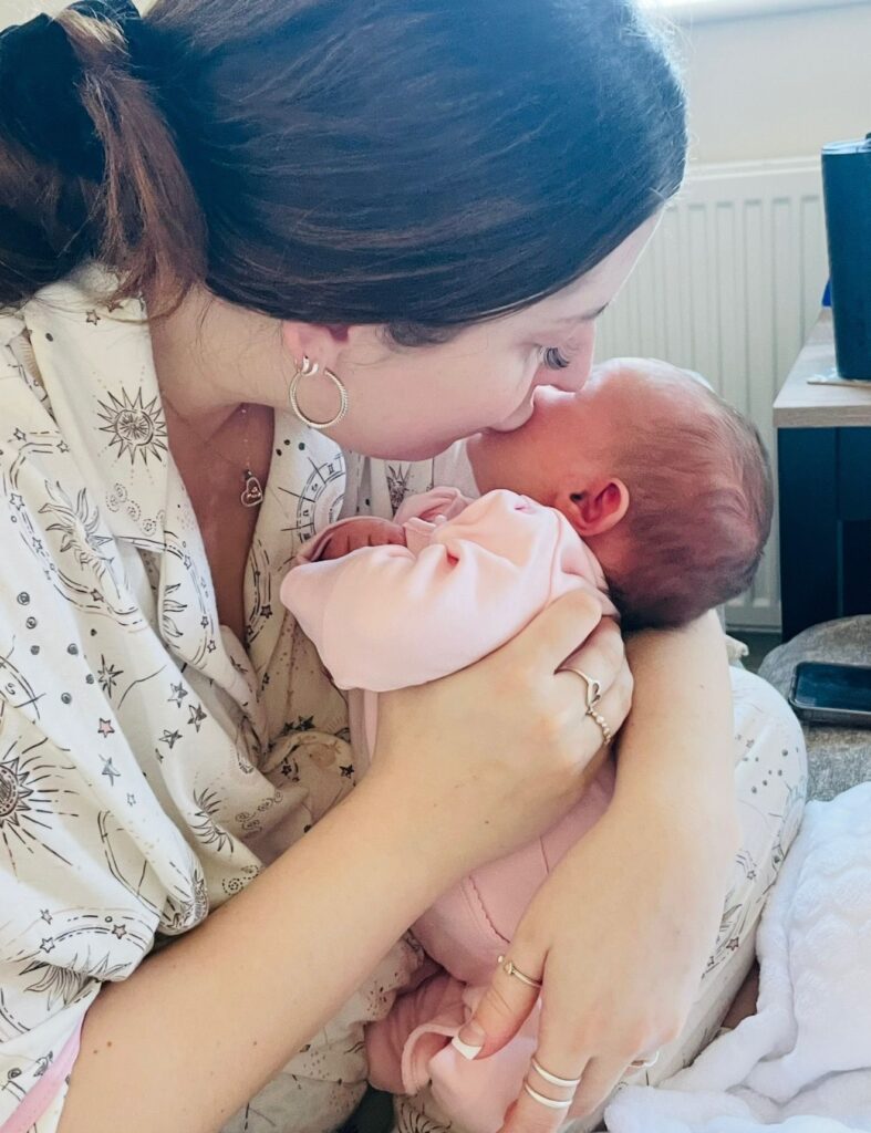 Bethany kissing her baby