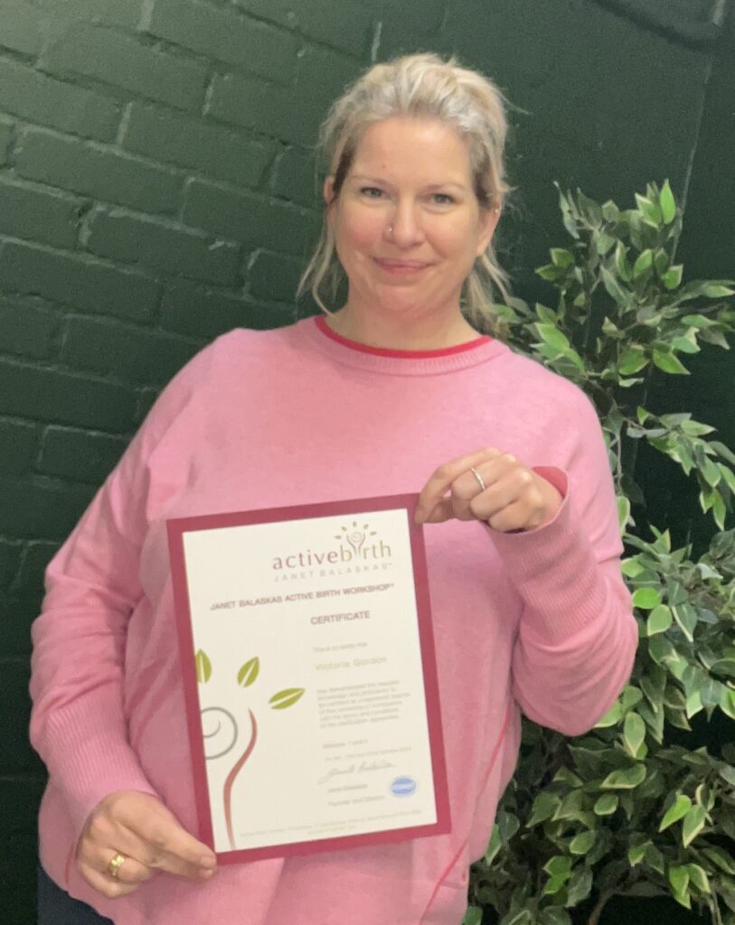Victoria Gordon holding her Active Birth certificate.