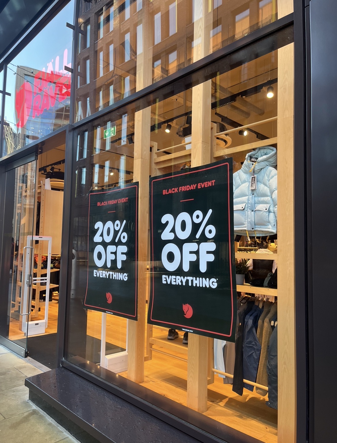 A poster on a shop window advertising Black Friday sales.