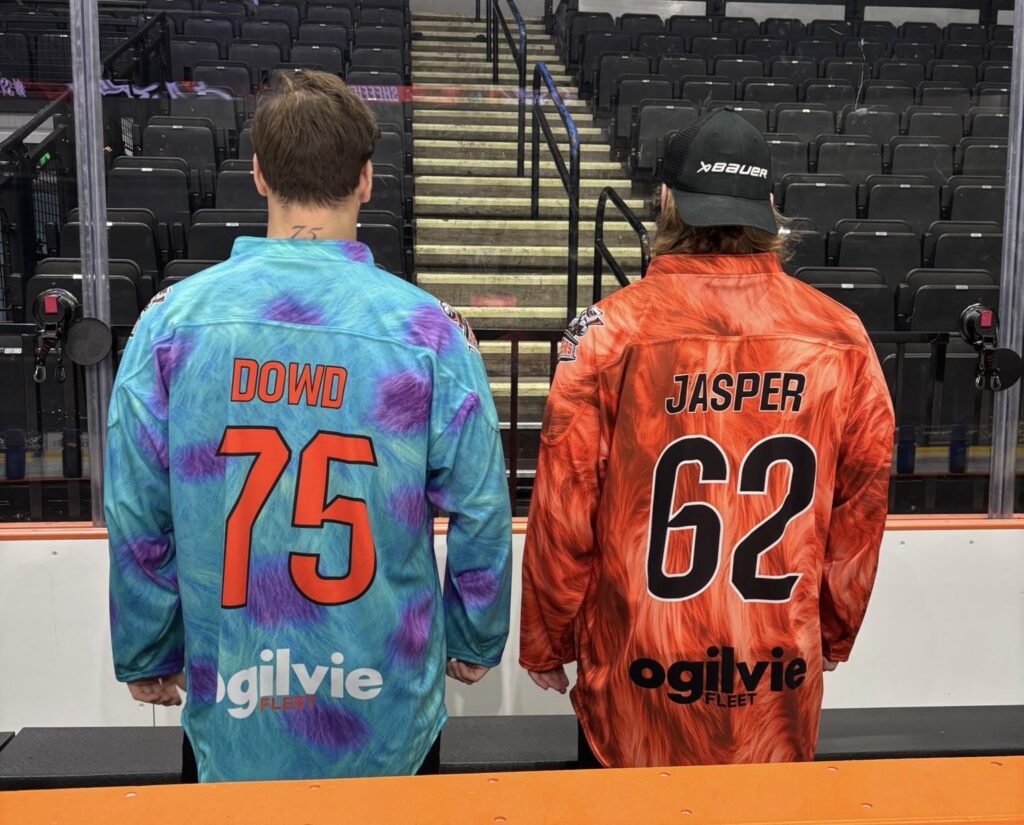 Evan Jasper (right) and Robert Dowd (left) in their limited edition warm up jerseys