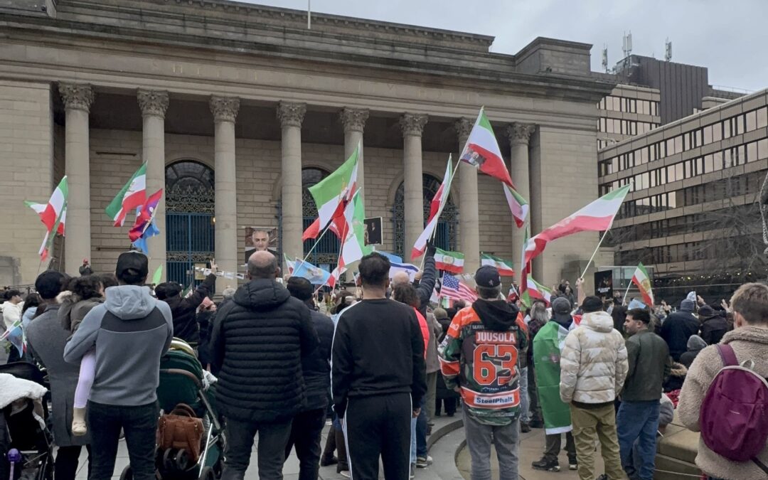 Crowds gather outside City Hall after the death of Iran’s supreme leader